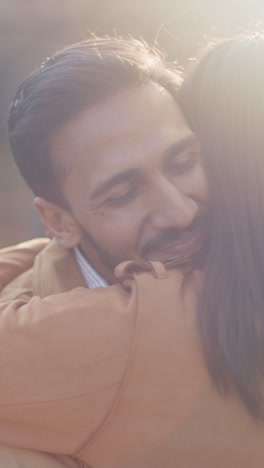 Vertical-Video-Close-Up-Of-Loving-Muslim-Couple-On-Date-Hugging-Outdoors-1